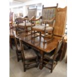 A 17th Century style carved oak refectory table and six chairs