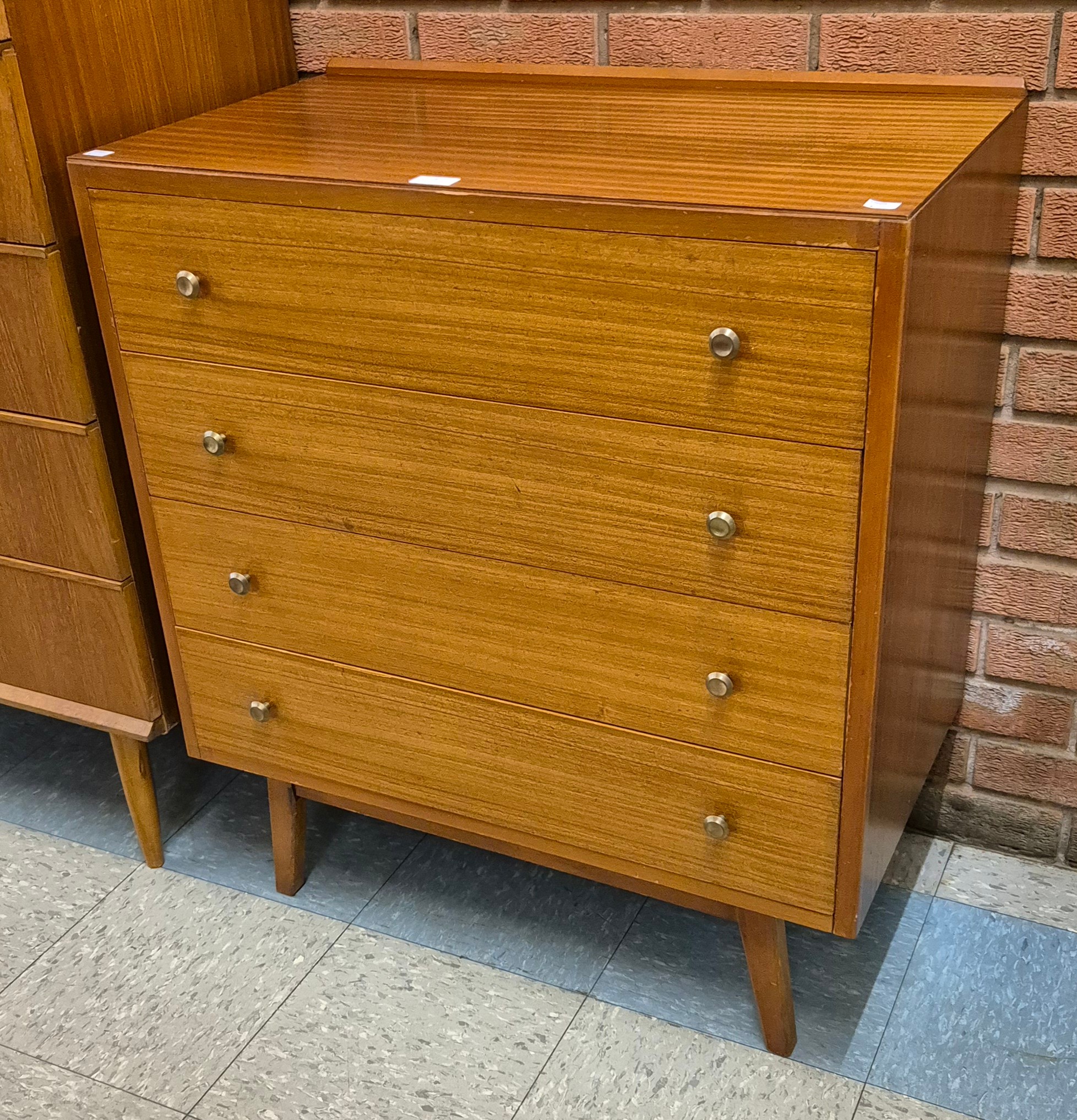 A teak chest of drawers