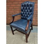 A mahogany and blue leather Gainsborough style chair