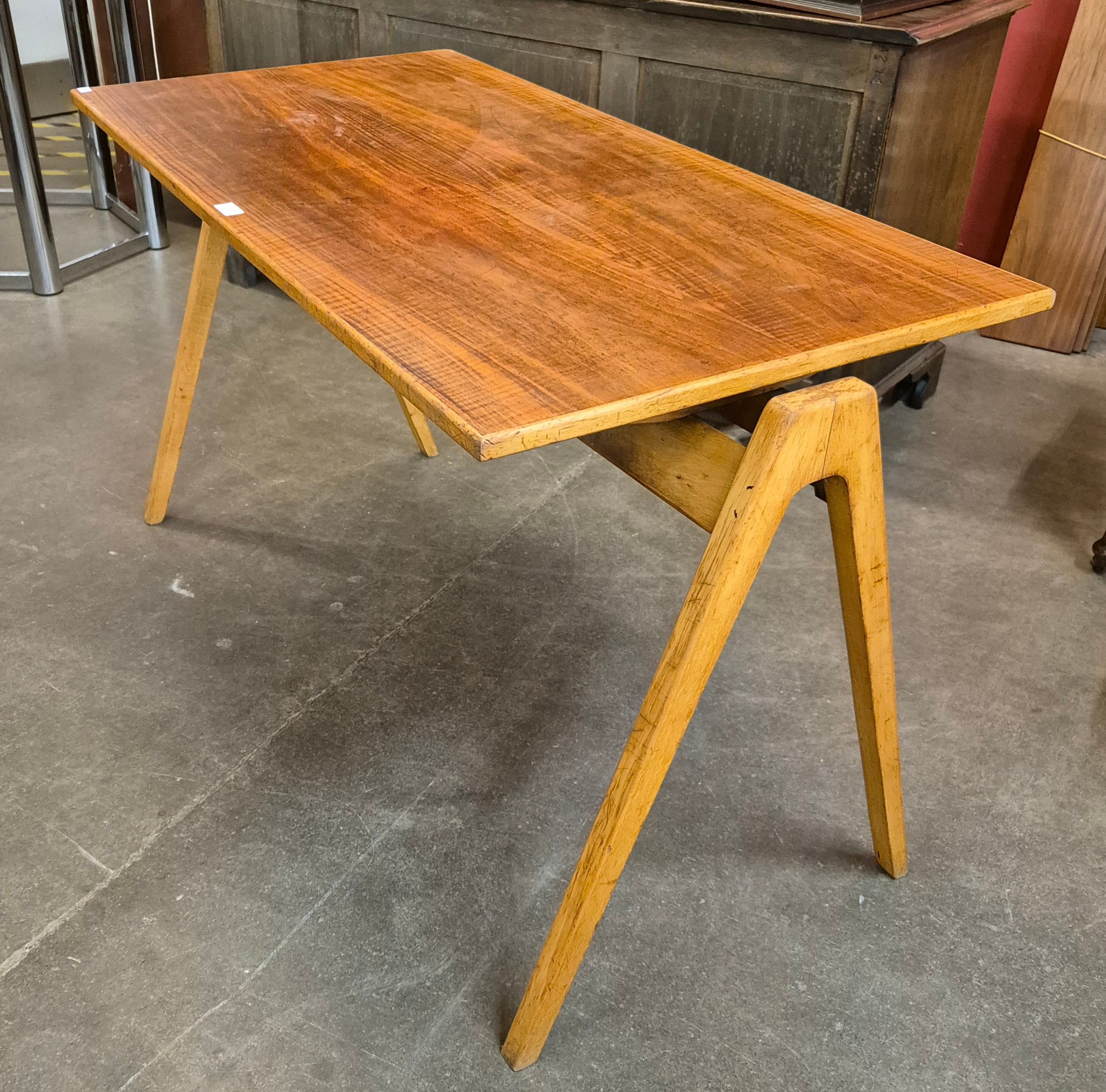 A Hille Hillestack walnut and beech rectangular A-frame dining/writing table, designed by Robin Day