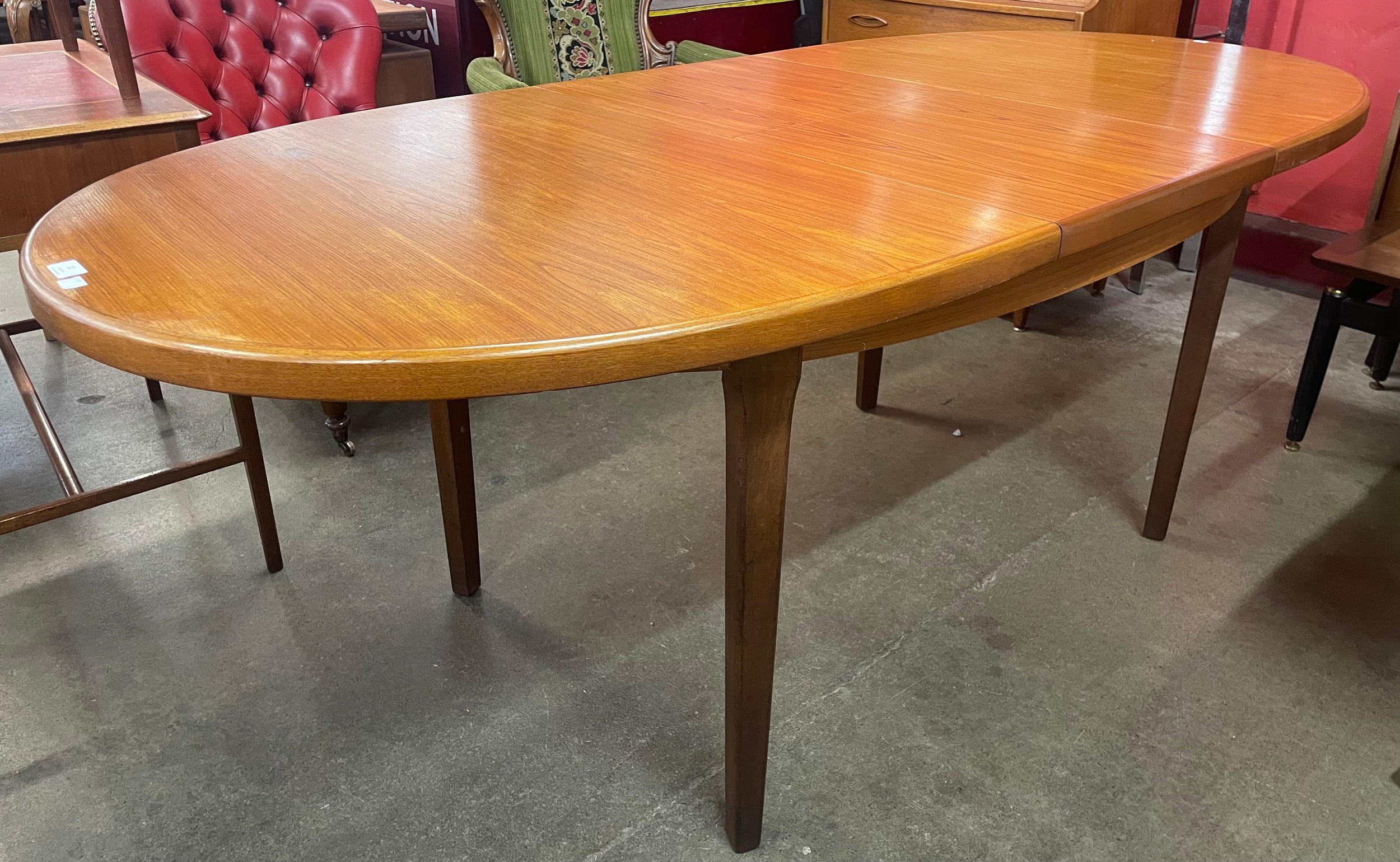 A teak extending dining table