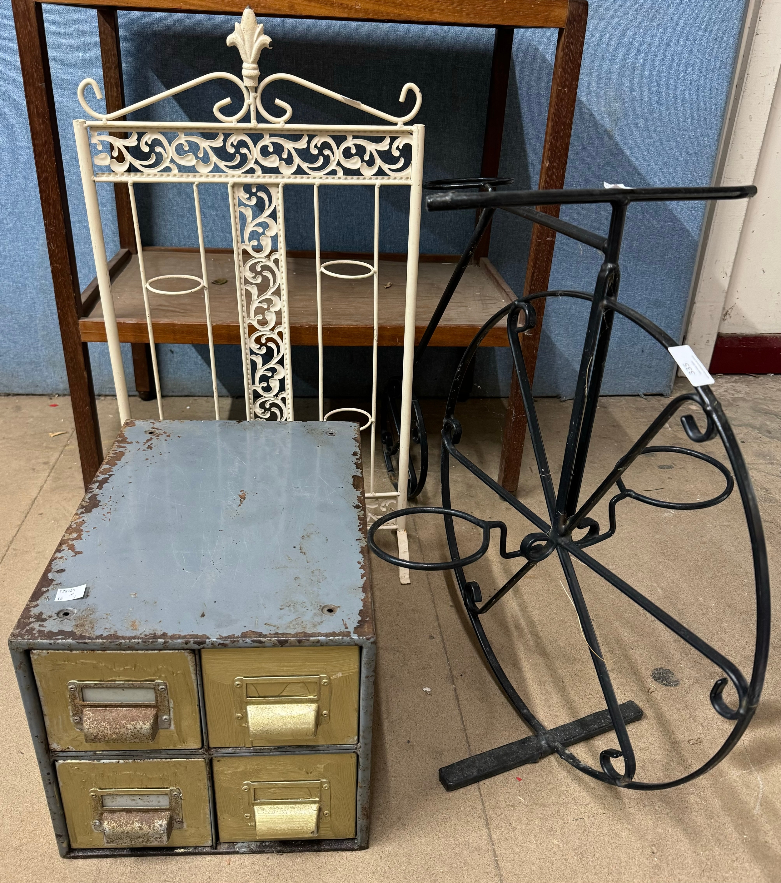 A metal index drawer cabinet, a painted bike plant stand and a metal plant stand