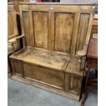 A Victorian style pine settle