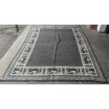 An Arts and Crafts style grey ground rug