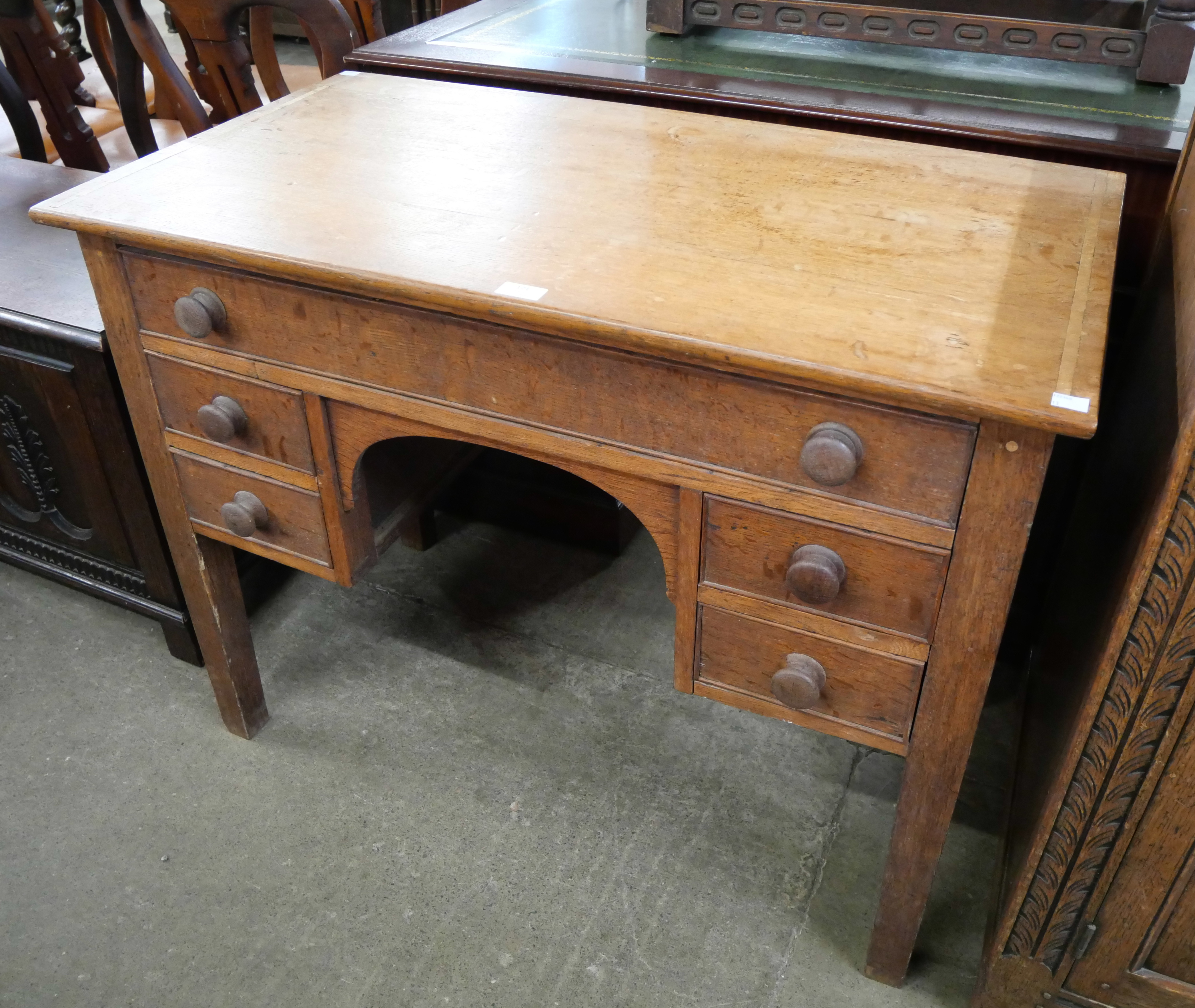 A Victorian oak five drawer side table