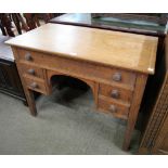 A Victorian oak five drawer side table