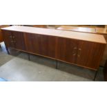 A fitted tola wood sideboard