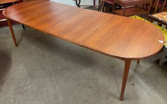 A Swedish Troeds teak two leaf extending dining table