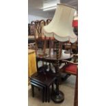 A Stag Minstrel mahogany nest of tables, a tripod wine table and an oak standard lamp