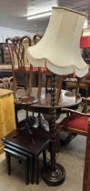A Stag Minstrel mahogany nest of tables, a tripod wine table and an oak standard lamp