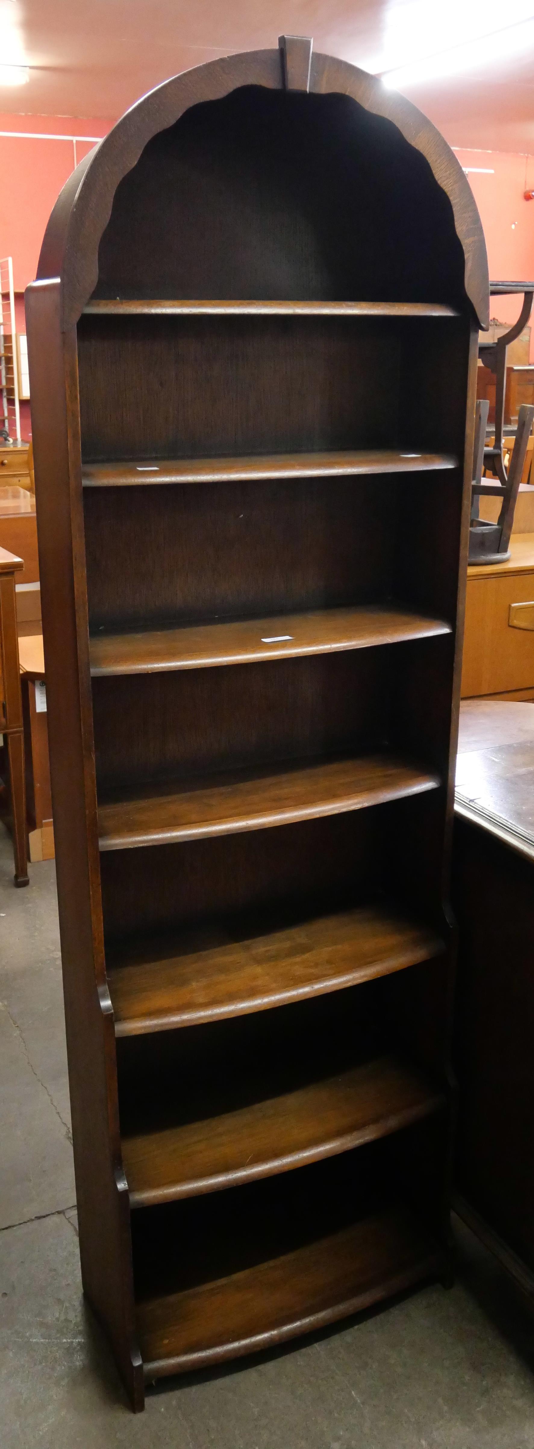 A tall oak waterfall open bookcase