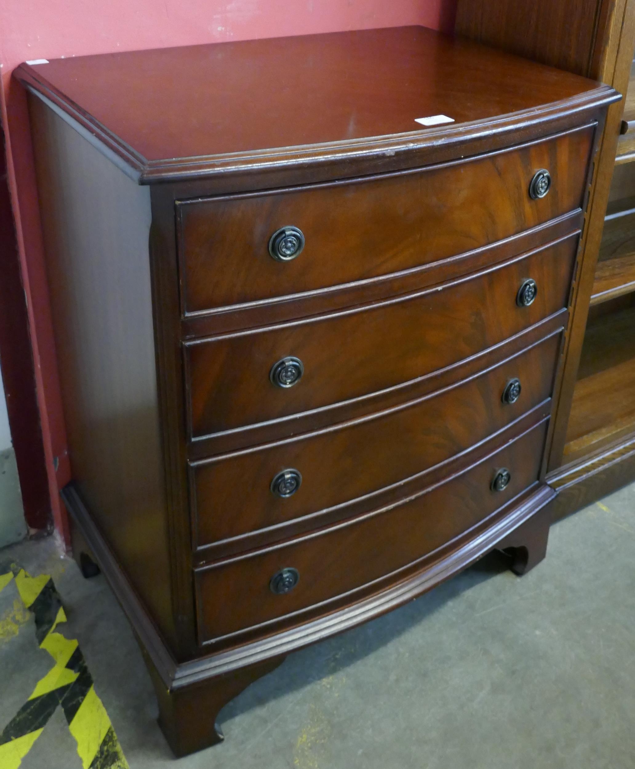 A small George III style mahogany bow front chest of drawers