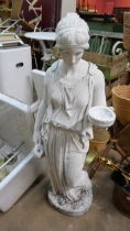 A concrete figure of a Grecian lady