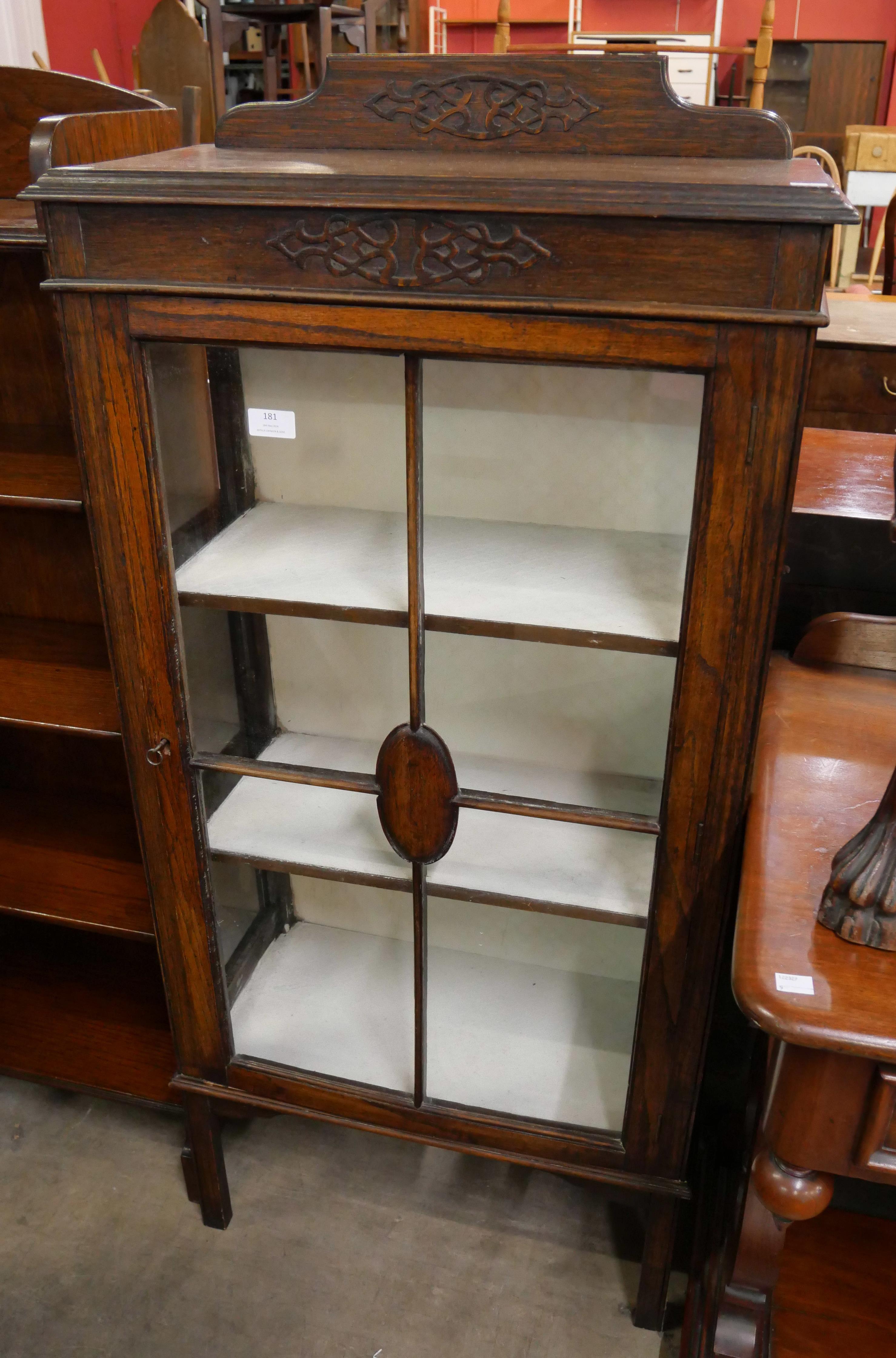 Ann early 20th Century carved oak display cabinet