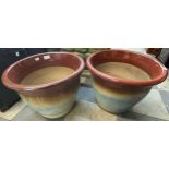 A pair of glazed terracotta garden plant pots