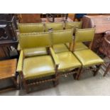 A set of six carved oak and green leather dining chairs