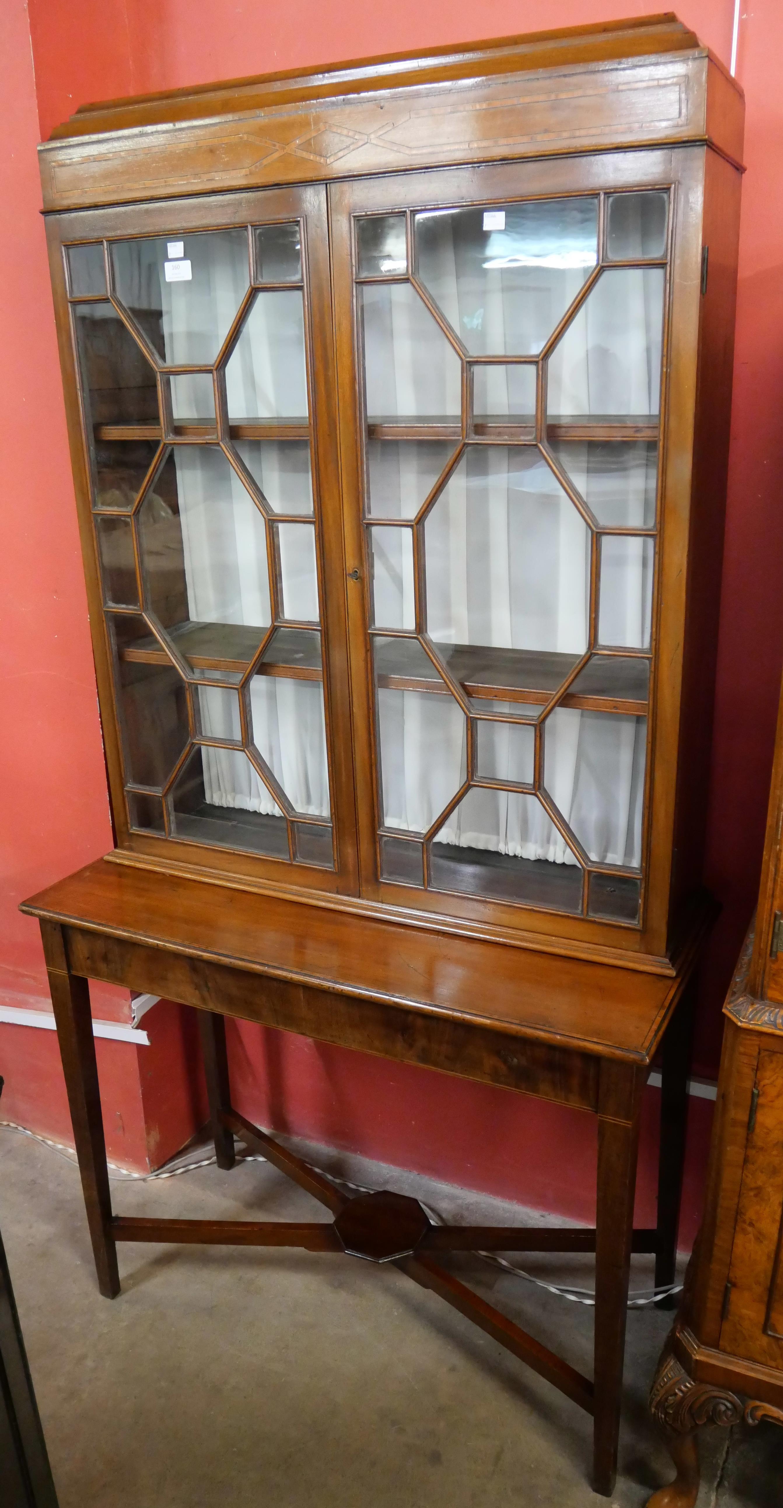 An Edward VII inlaid mahogany display cabinet on stand