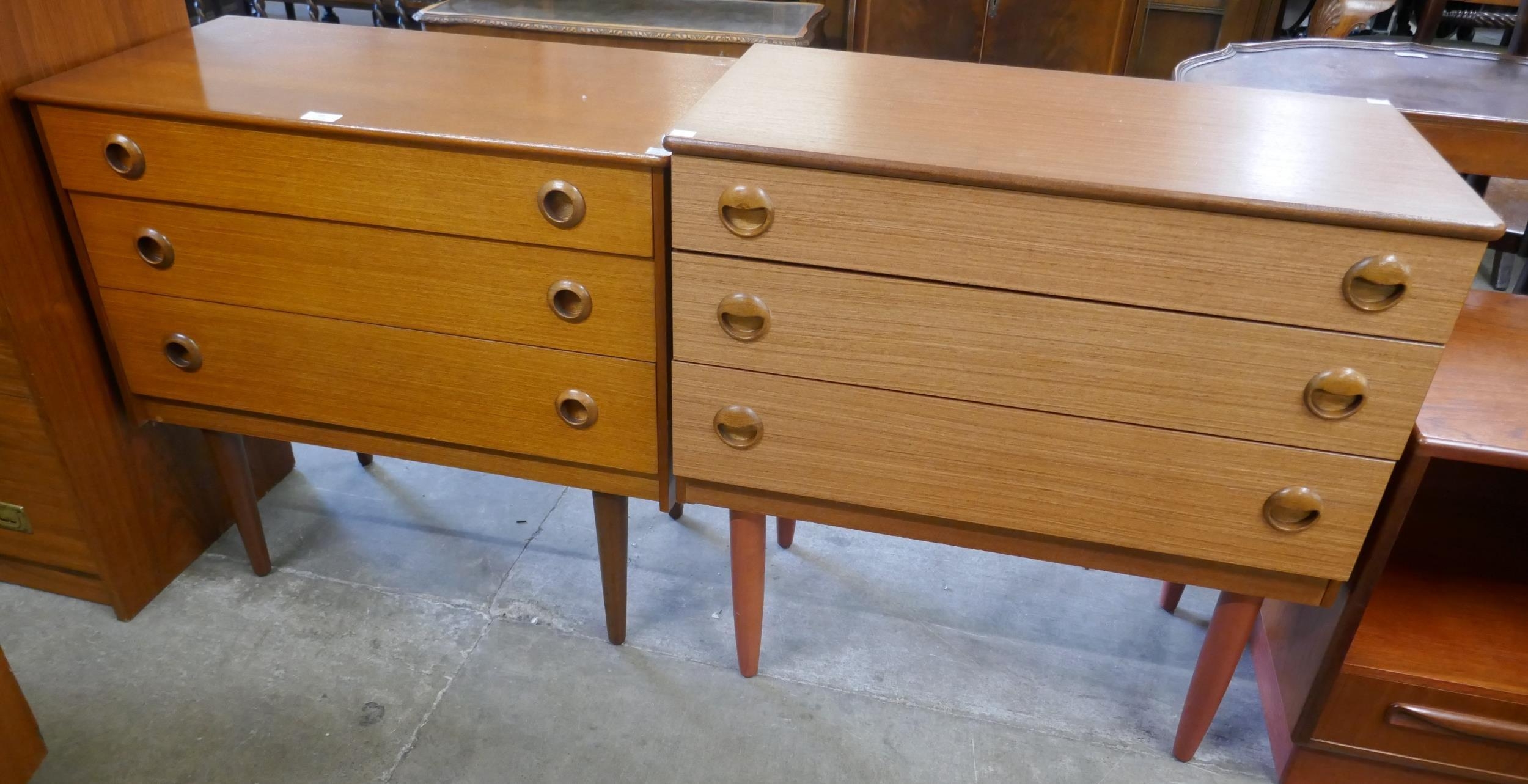 A pair of similar teak chests of drawers