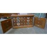 A late 19th century American Amberg patent mahogany index drawer cabinet