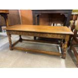 An early Century carved oak bench