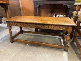 An early Century carved oak bench