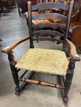 An 18th Century style elm rush seated rocking chair