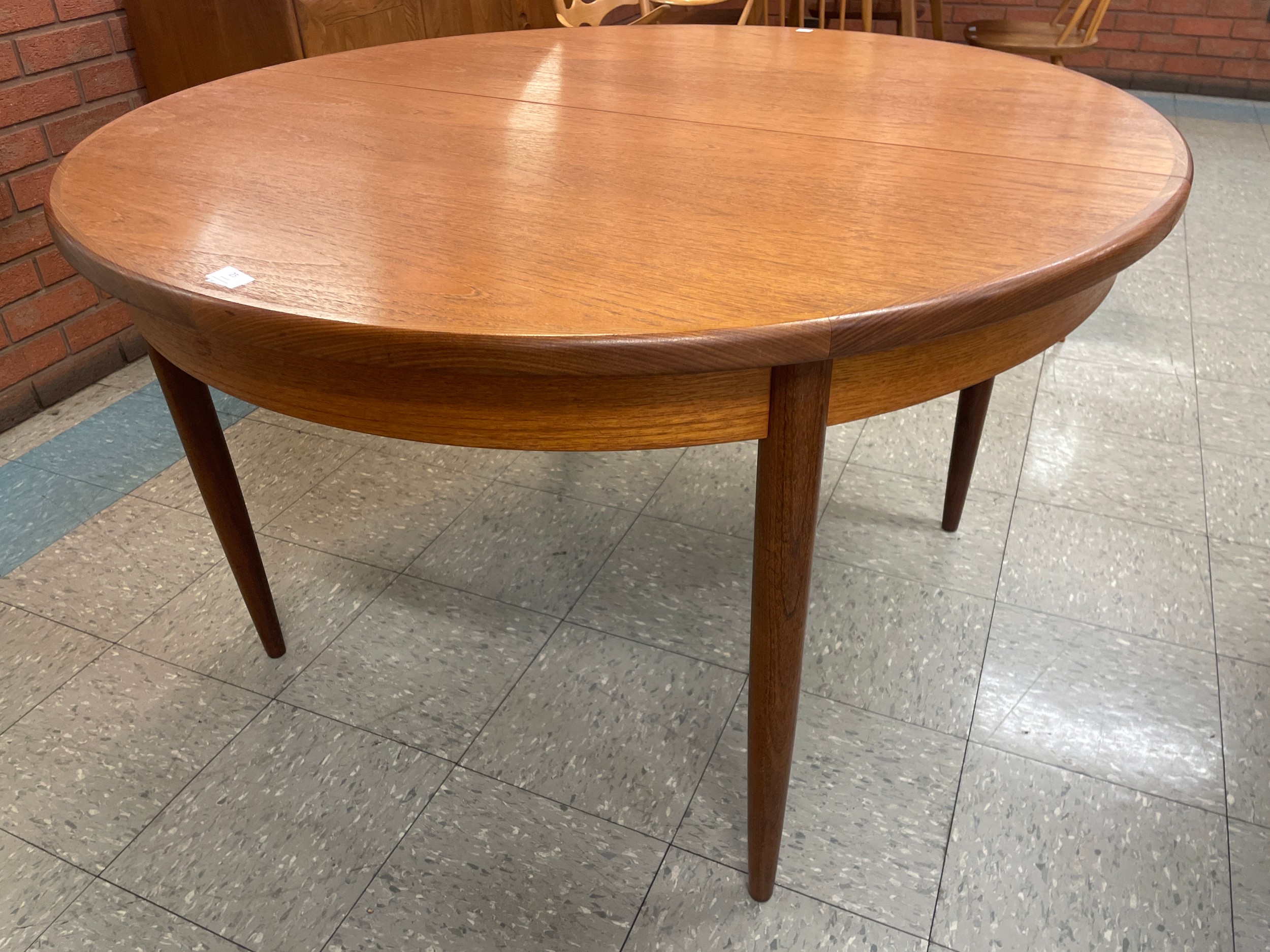 A G-Plan Fresco teak circular extending dining table