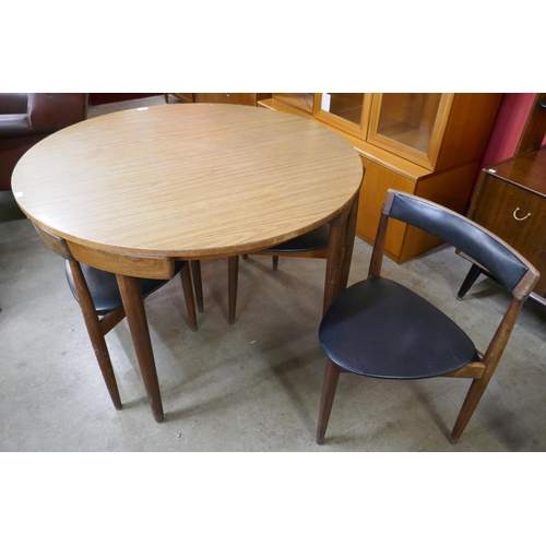 A Danish Frem Rojle teak and simulated rosewood Roundette dining table and four chairs, designed - Image 2 of 2