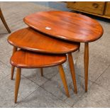 An Ercol elm and beech pebble shaped nest of tables