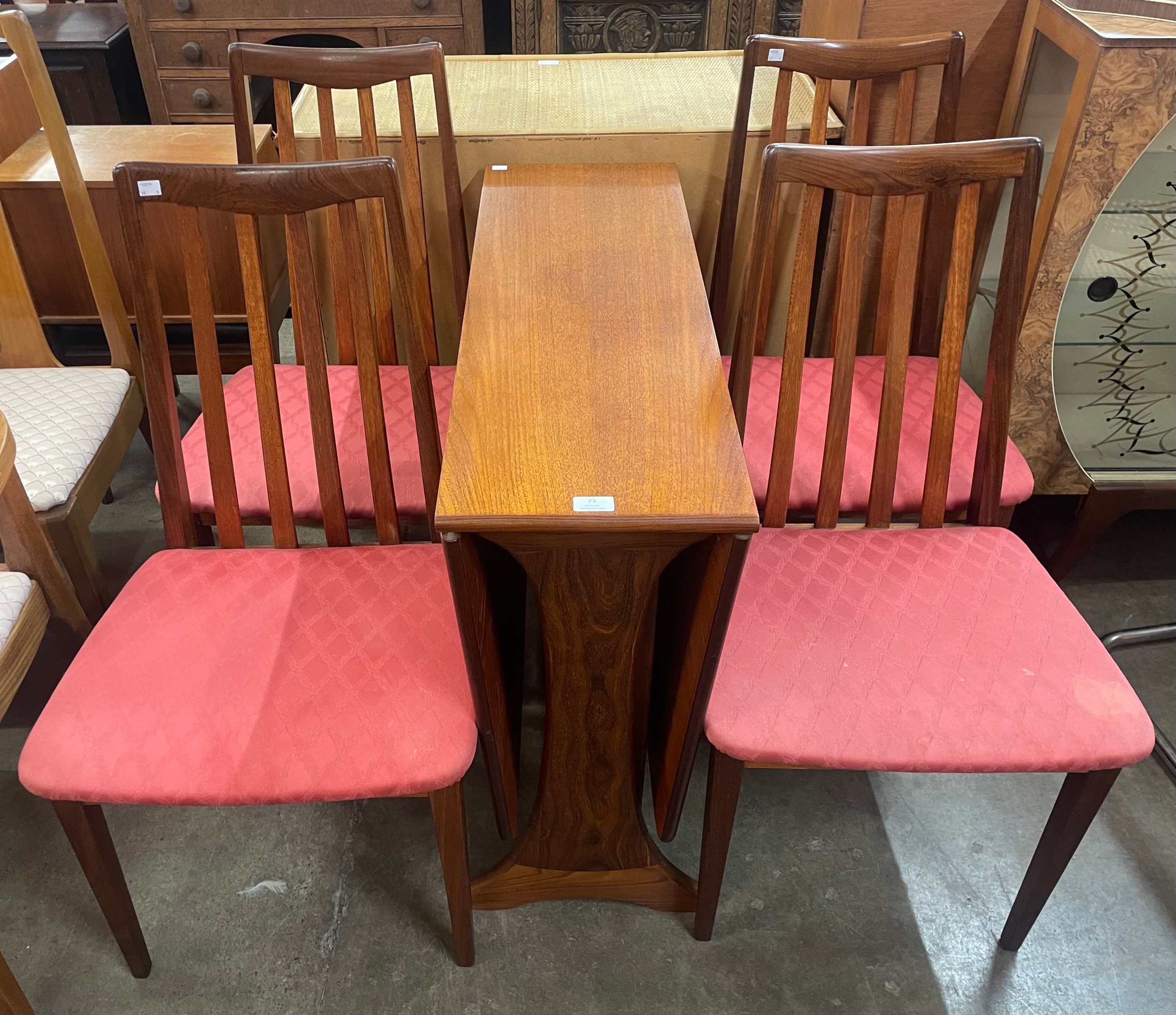 A G-Plan Fresco teak drop-leaf table and four chairs