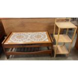 A teak and tiled topped coffee table and a bamboo and rattan three tier whatnot