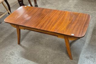 A walnut rectangular extending coffee table