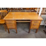 An oak desk and a painted display cabinet