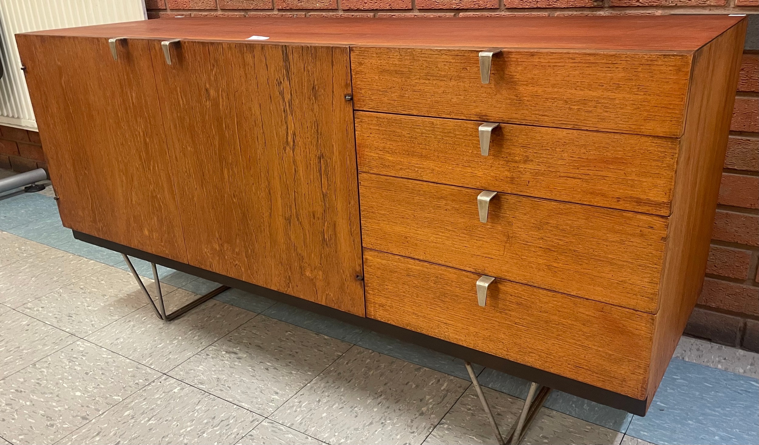 A Stag S-Range teak sideboard, on chrome hairpin legs, designed by John & Sylvia Reid