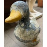 A concrete garden figure of a duck
