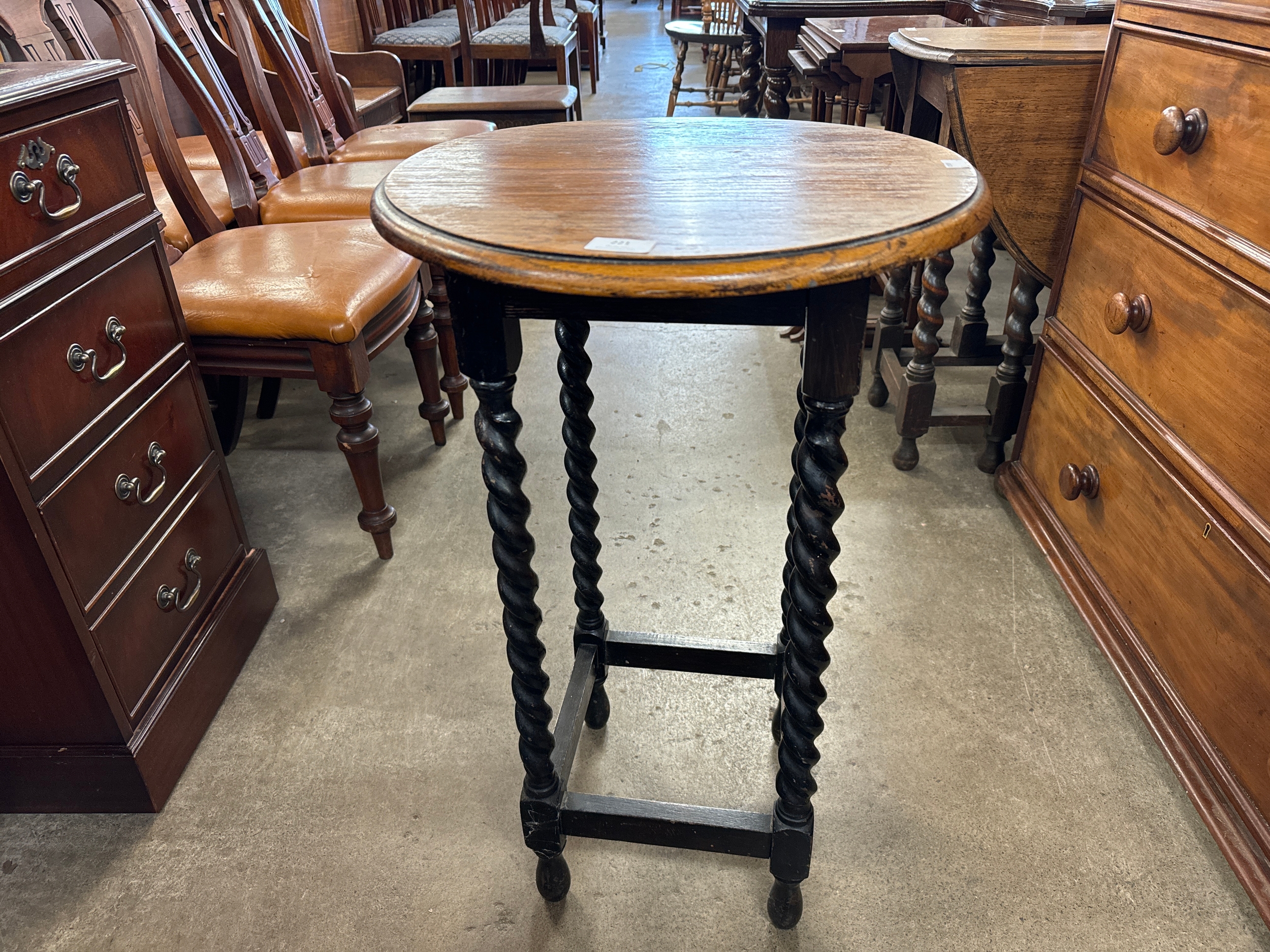 An early 20th Century oak barleytwist circular occasional table