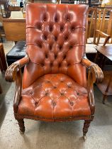 A Regency style mahogany and red leather open armchair