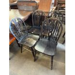 A set of four beech wheelback kitchen chairs