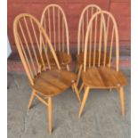A set of four Ercol Blonde elm and beech Quaker chairs