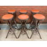 A set of six industrial style chrome bar stools