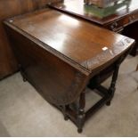 An early 20th Century carved oak gateleg table