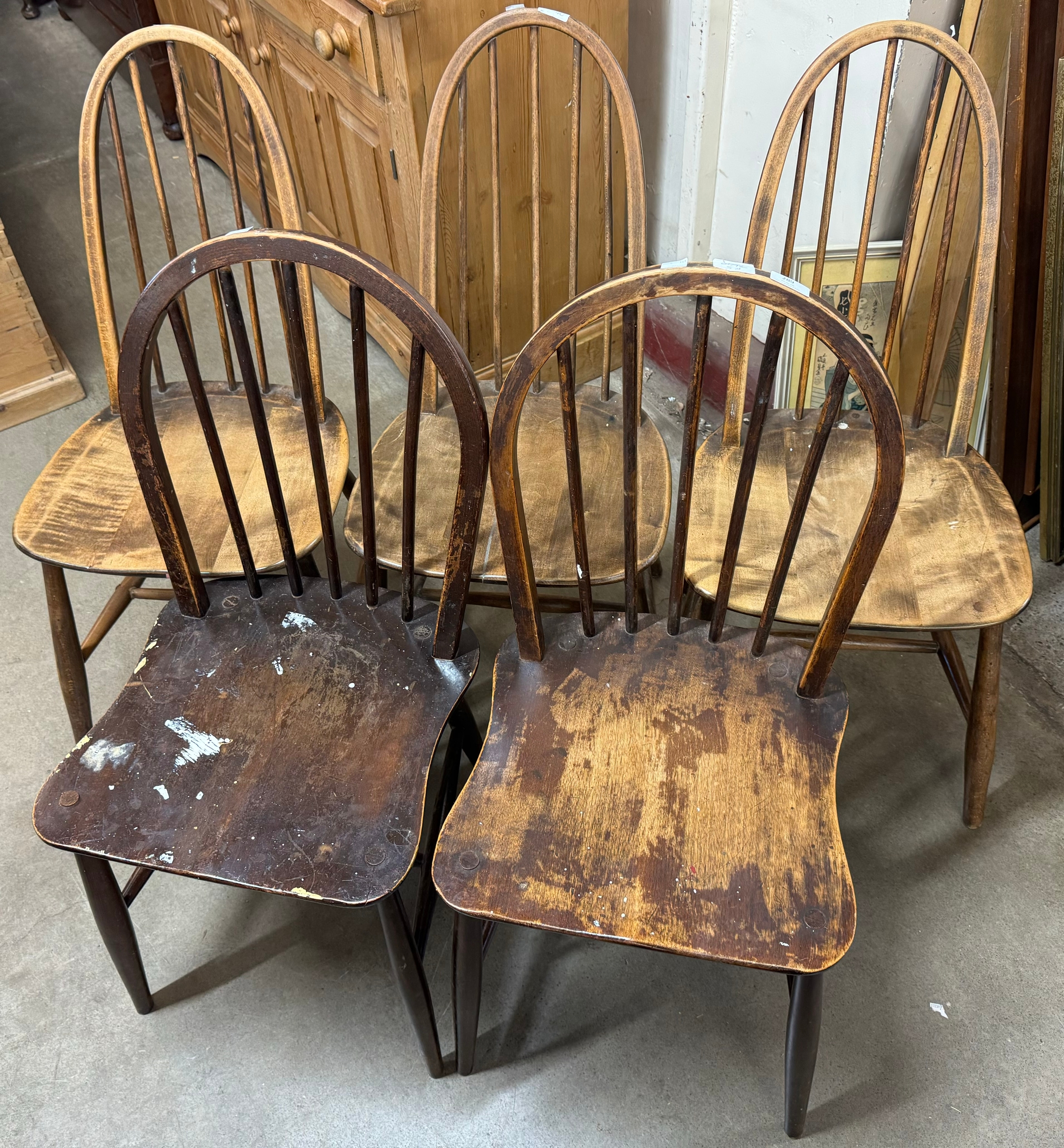 A pair of Ercol elm and beech Windsor chairs and three Quaker chairs