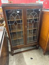 An Edward VII mahogany and stained glass two door bookcase
