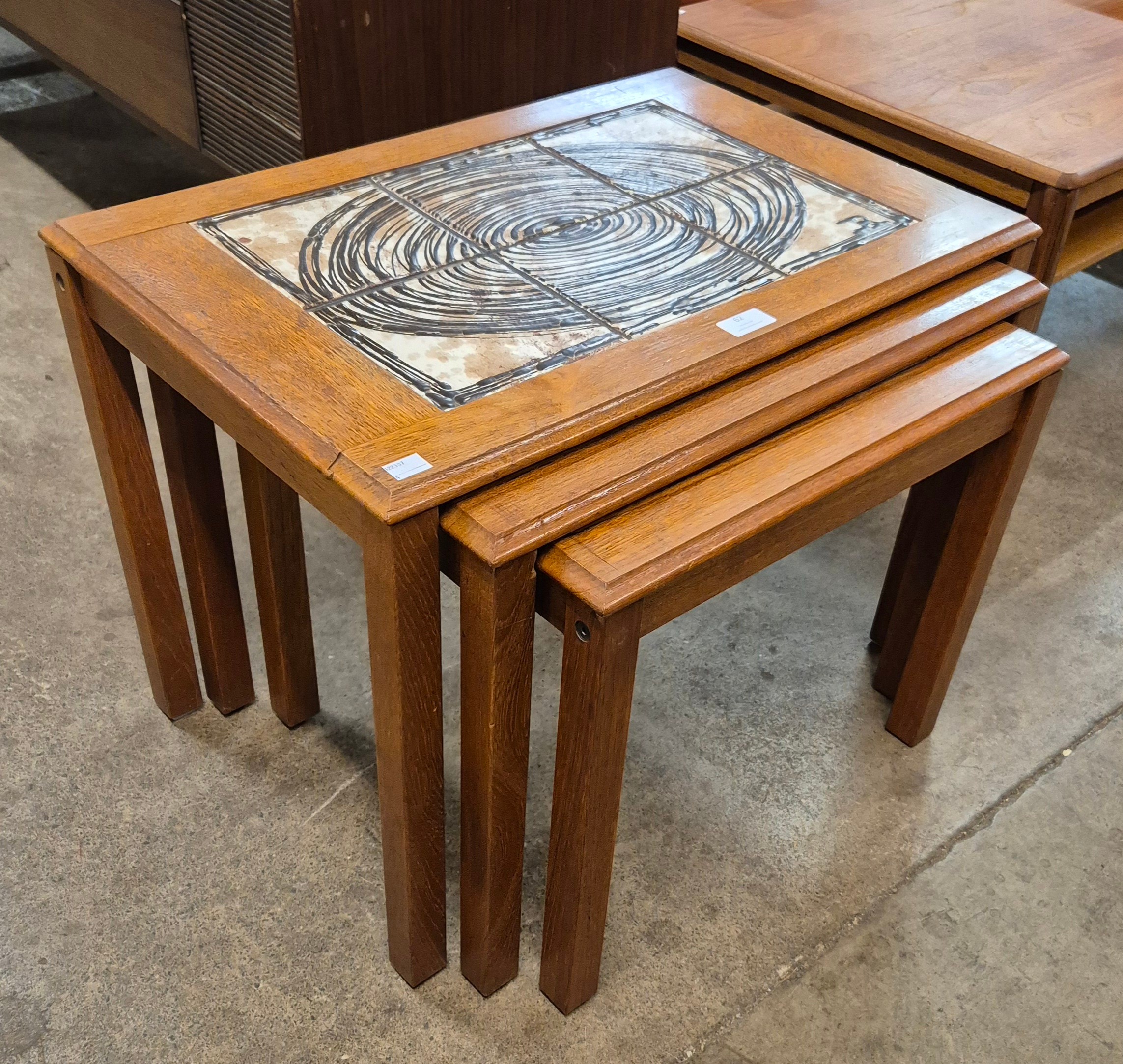 A Danish Trioh teak and tiled topped nest of tables