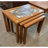 A Danish Trioh teak and tiled topped nest of tables