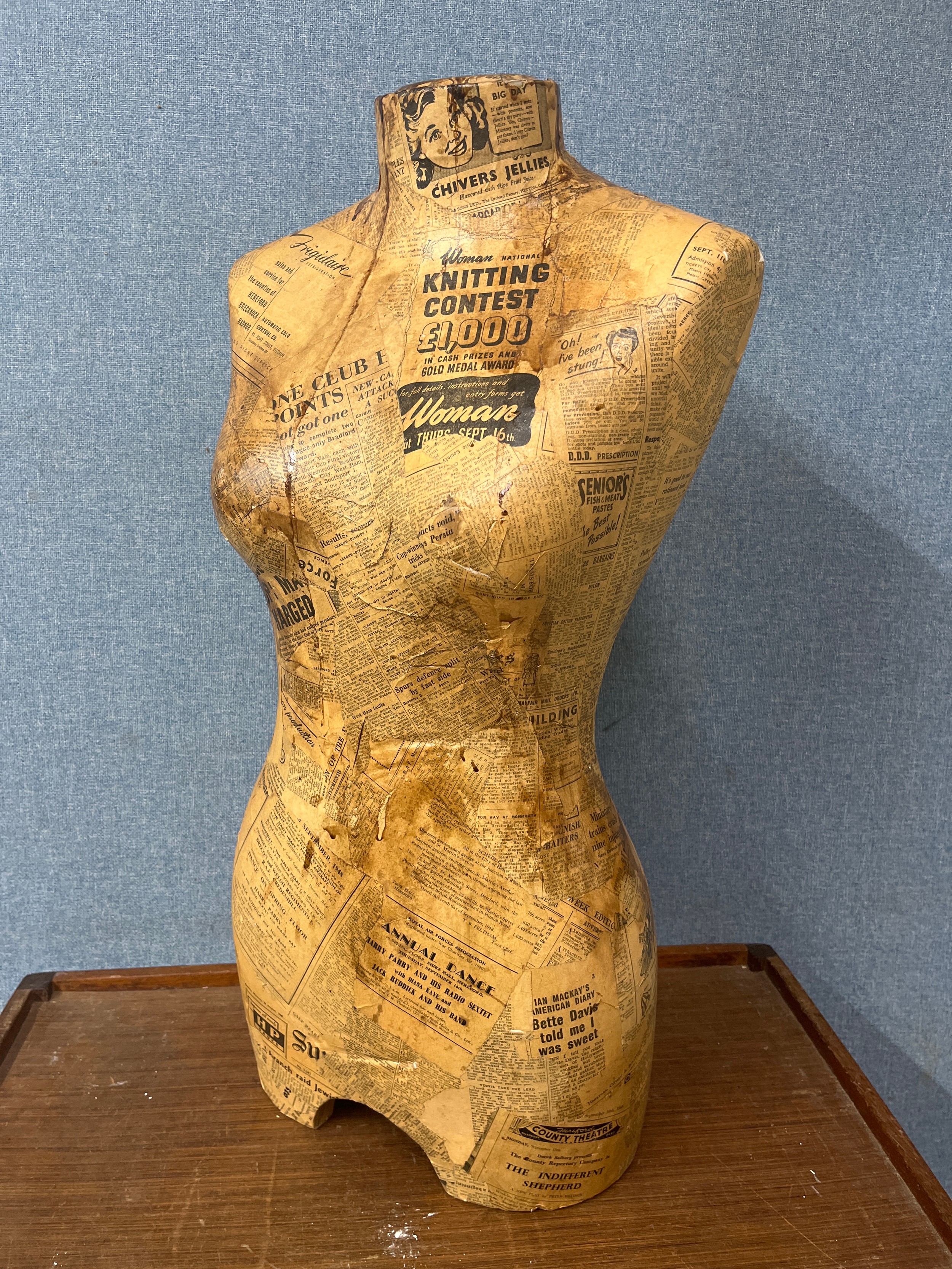 A decoupage half mannequin