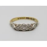 An 18ct gold and platinum set three stone diamond ring, 2.8g, O