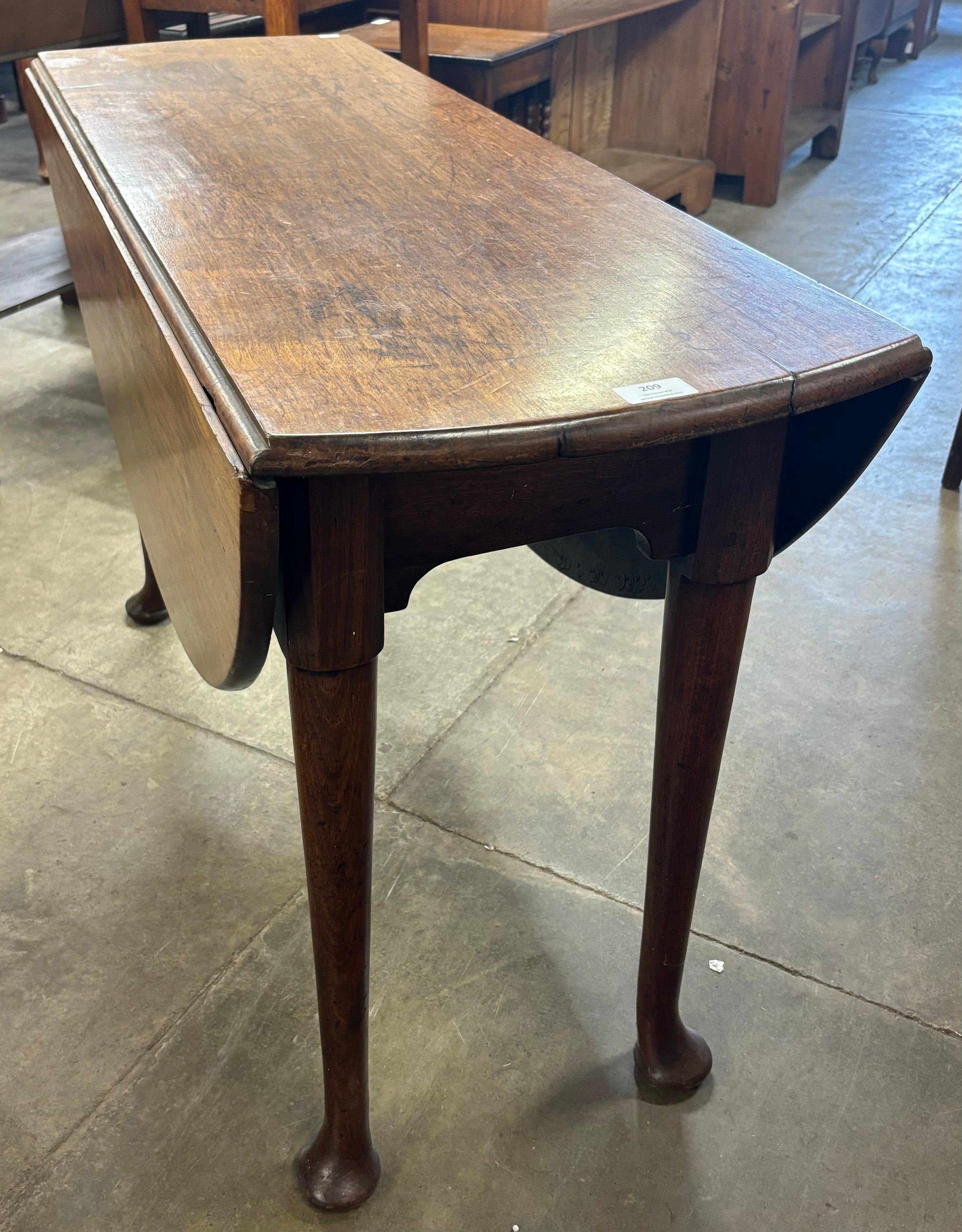 A George II mahogany drop-leaf dining table