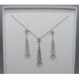 A pair of silver Art Deco style Swarovski cubic zirconia drop earrings and matching pendant by