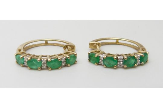 A pair of 9ct gold, emerald and diamond cuff style earrings, 2.6g - Image 1 of 3